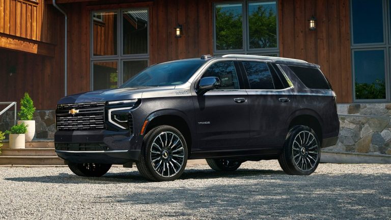 Chevrolet Tahoe High Country parked outside a modern rustic home