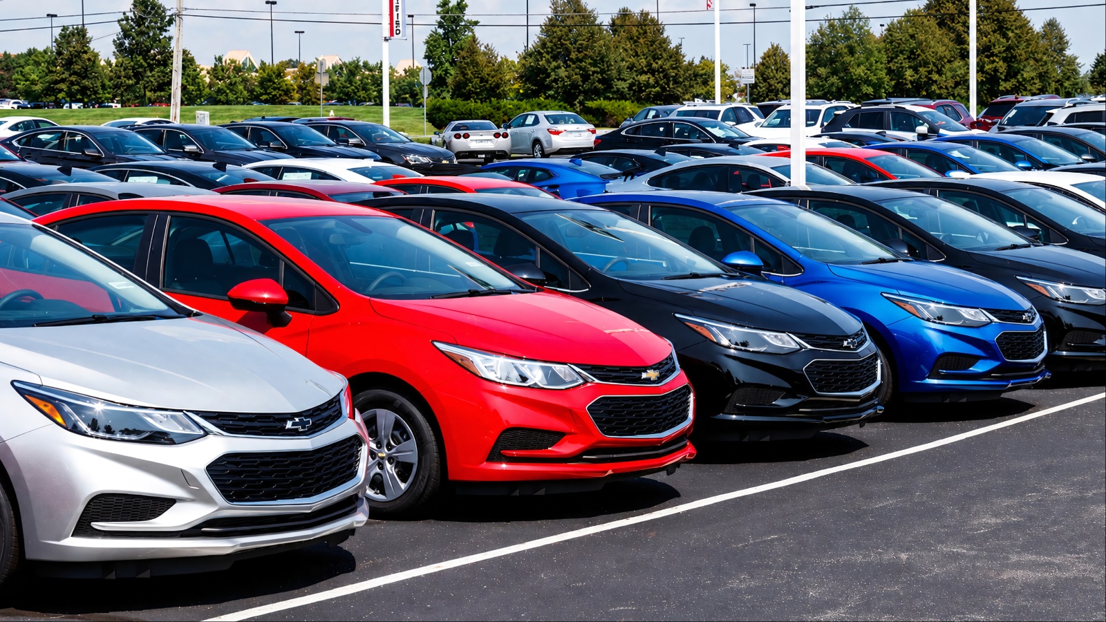 crowded dealership lot showcases a wide selection of used Chevrolet vehicles for buyers
