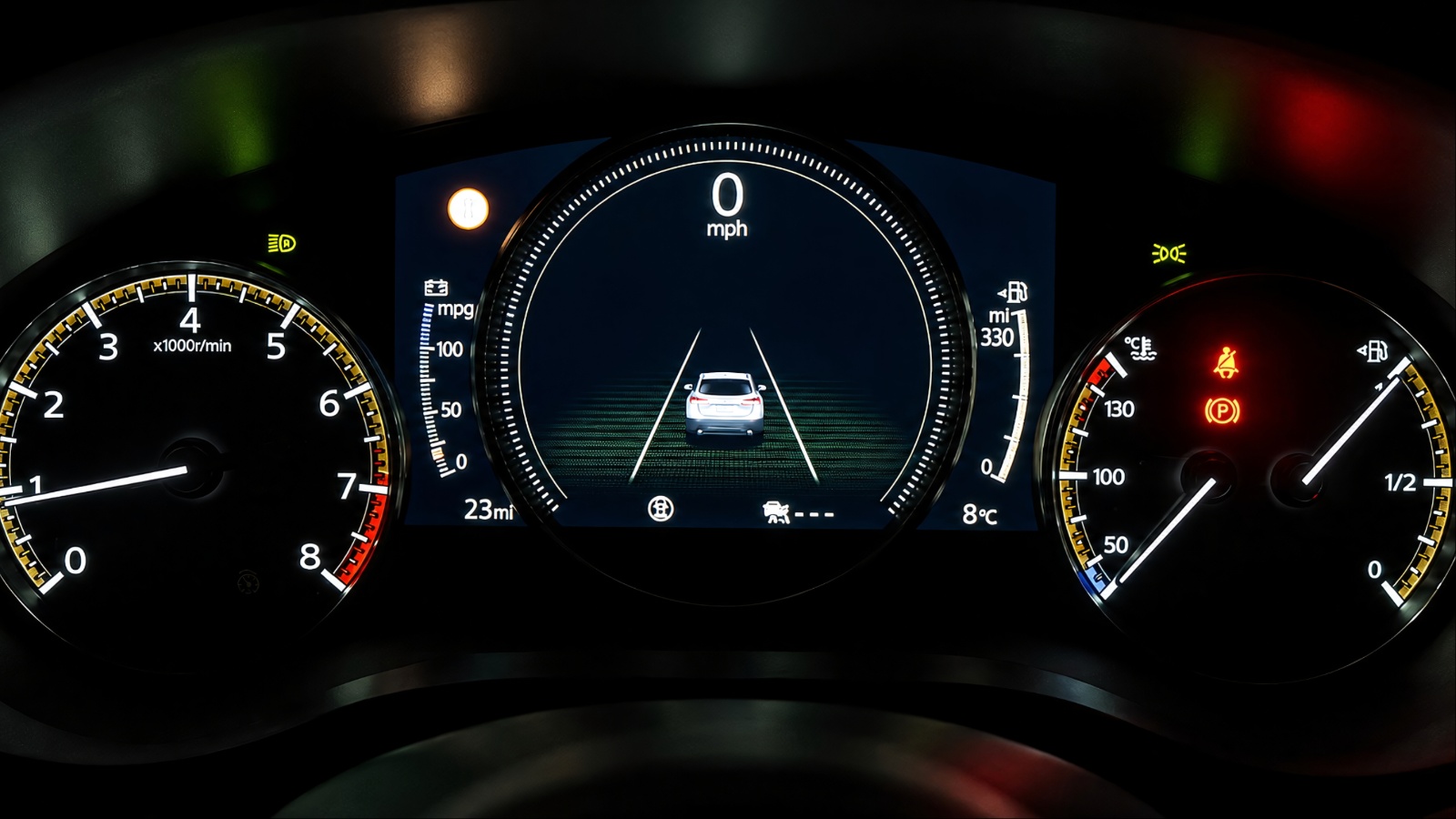 digital car dashboard displaying speed, RPM