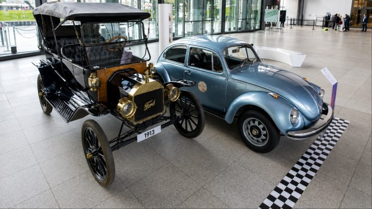 Ford Model T displayed beside Volkswagen Beetle