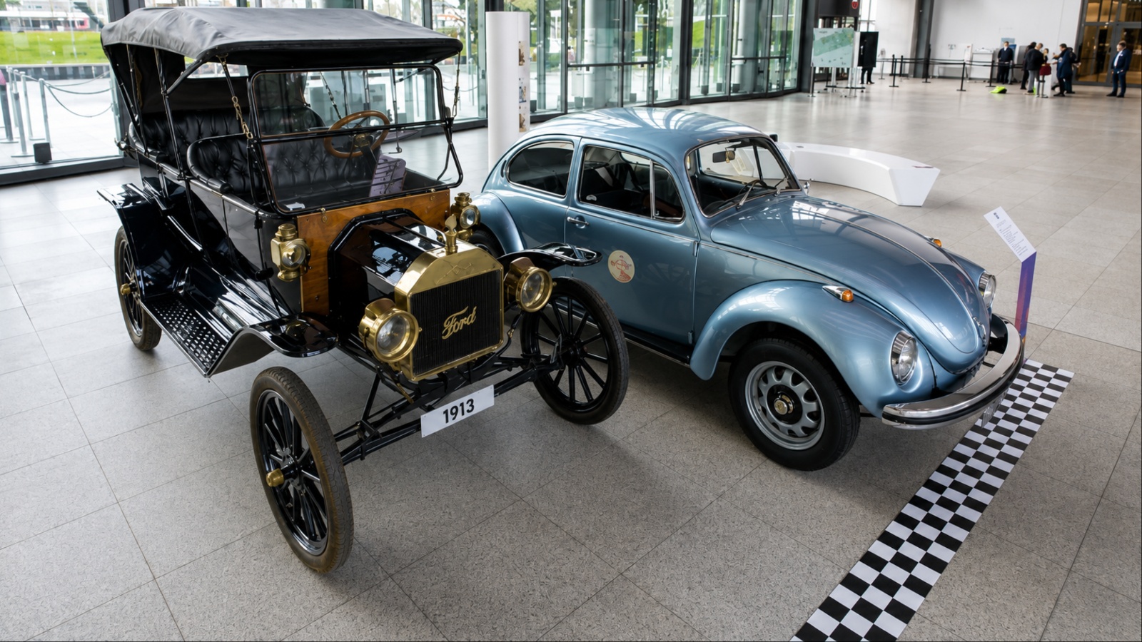 Ford Model T displayed beside Volkswagen Beetle