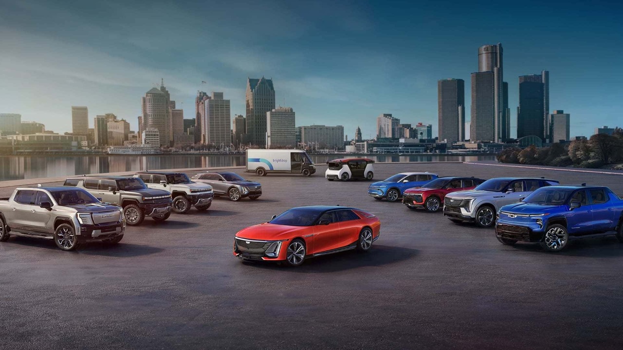 General Motors electric vehicle lineup displayed against a Detroit skyline