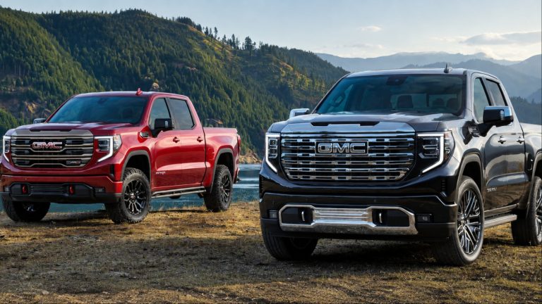 A GMC Sierra and SLT is standing in a rough patchy road
