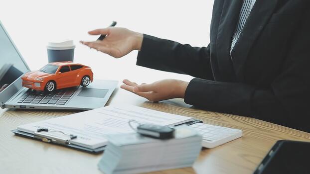 insurance officers hand over the car keys after the tenant have signed an auto insurance document or a lease or agreement document buying or selling a new or used car with a car free video Dealership Documentation and Admin Fees