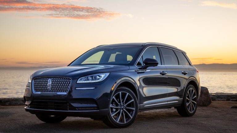 Lincoln Corsair SUV parked near a waterfront during a golden sunset