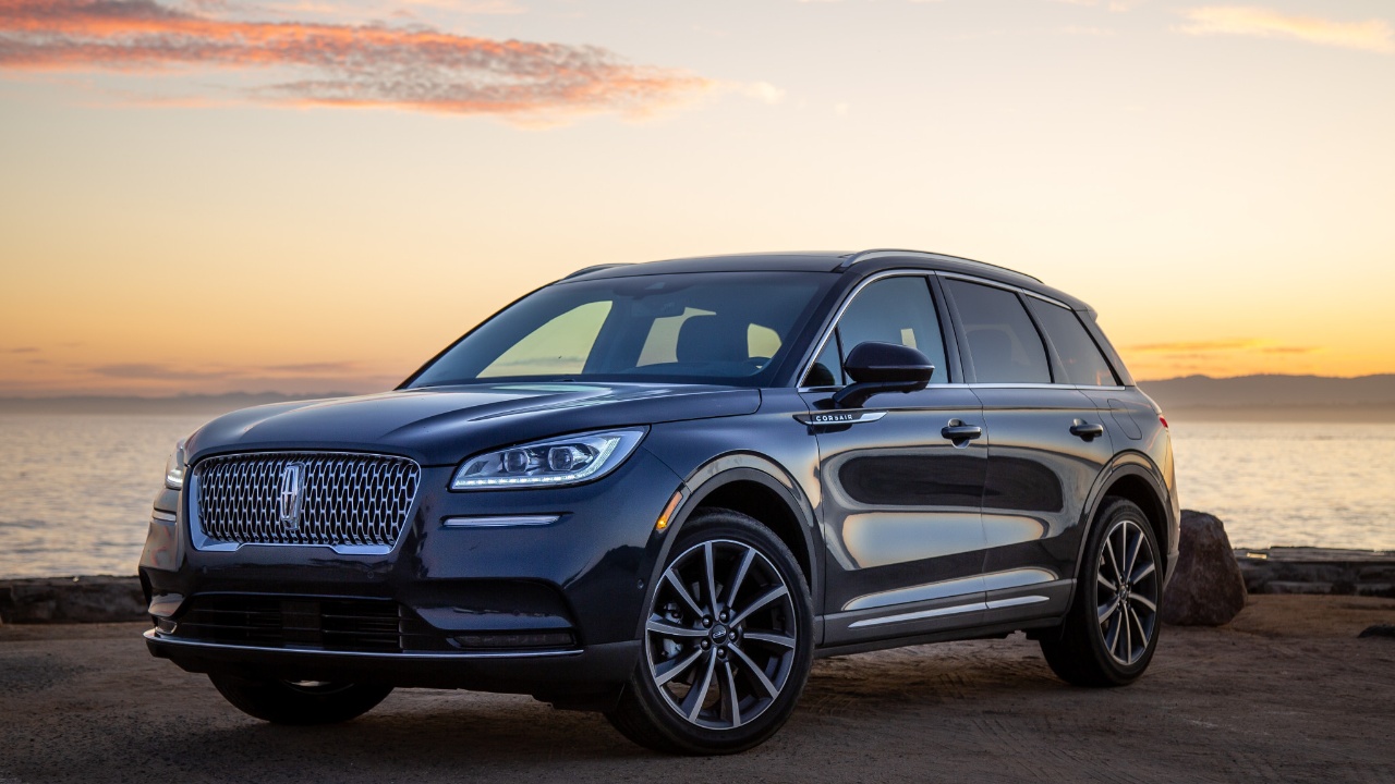 Lincoln Corsair SUV parked near a waterfront during a golden sunset