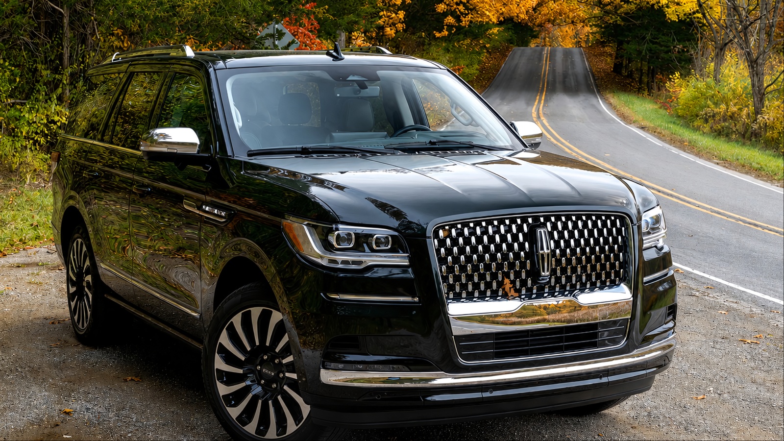 Lincoln Navigator parked on a scenic road surrounded by colorful autumn foliage