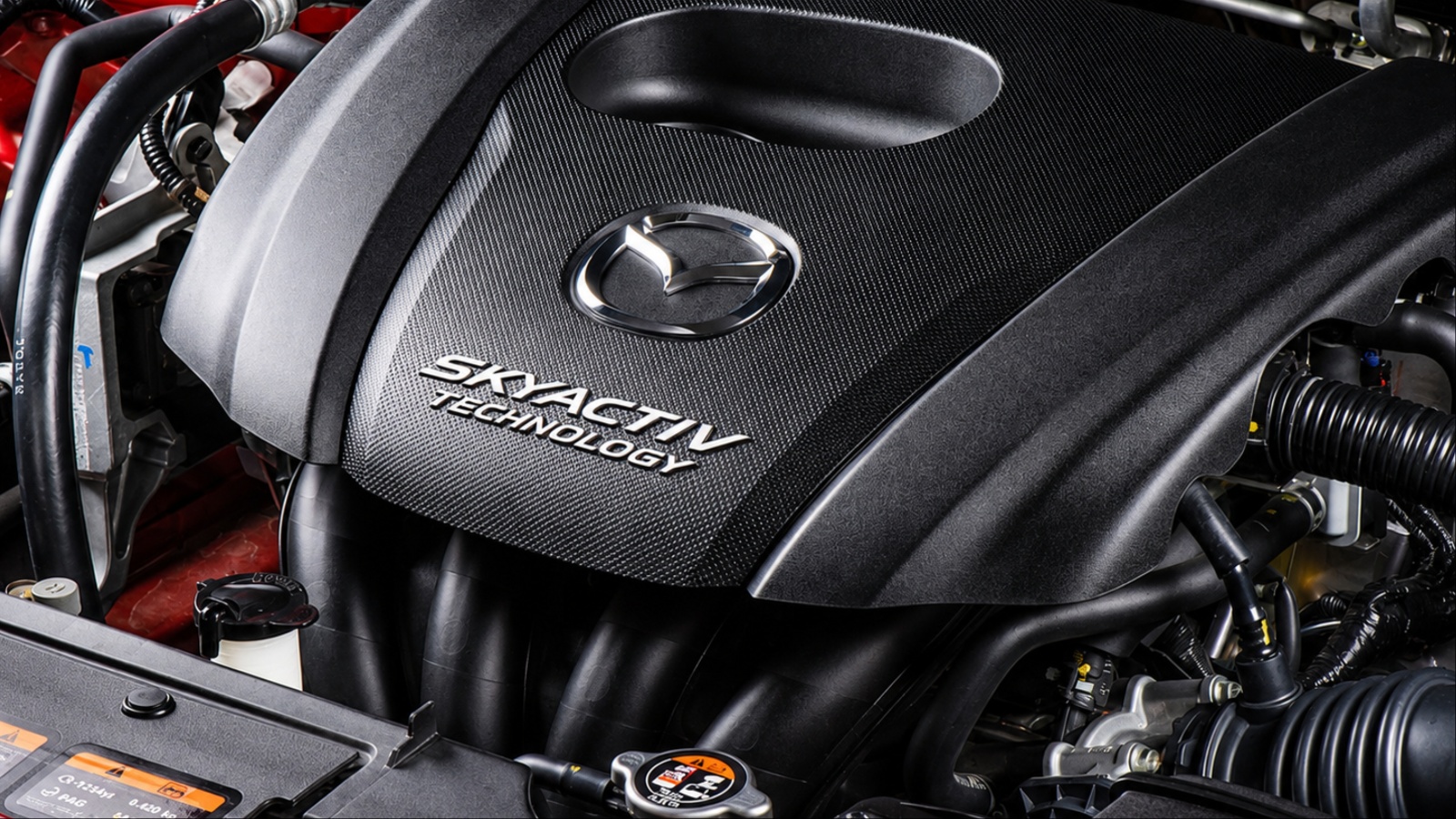 Mazda’s Skyactiv-G 2.5-liter naturally aspirated four-cylinder engine emphasizes efficiency, simplicity, and smooth power delivery