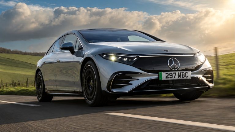 A Mercedes-Benz EQS is cruising on the road at high speeds