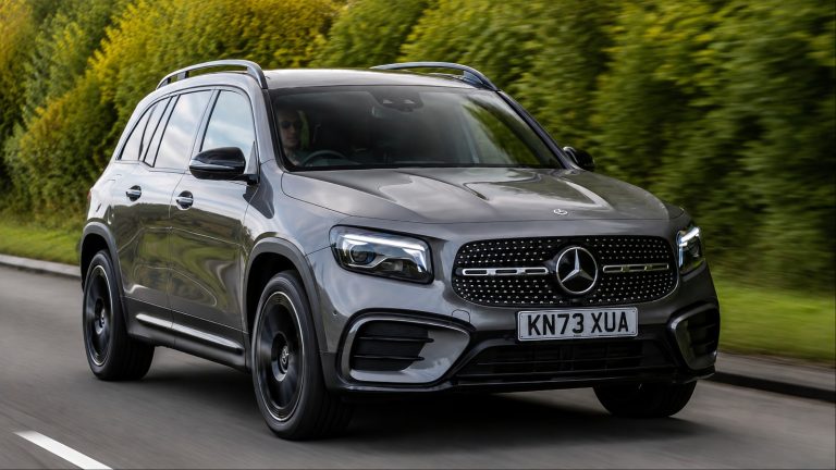 Mercedes-Benz GLB-Class SUV driving on a tree-lined road