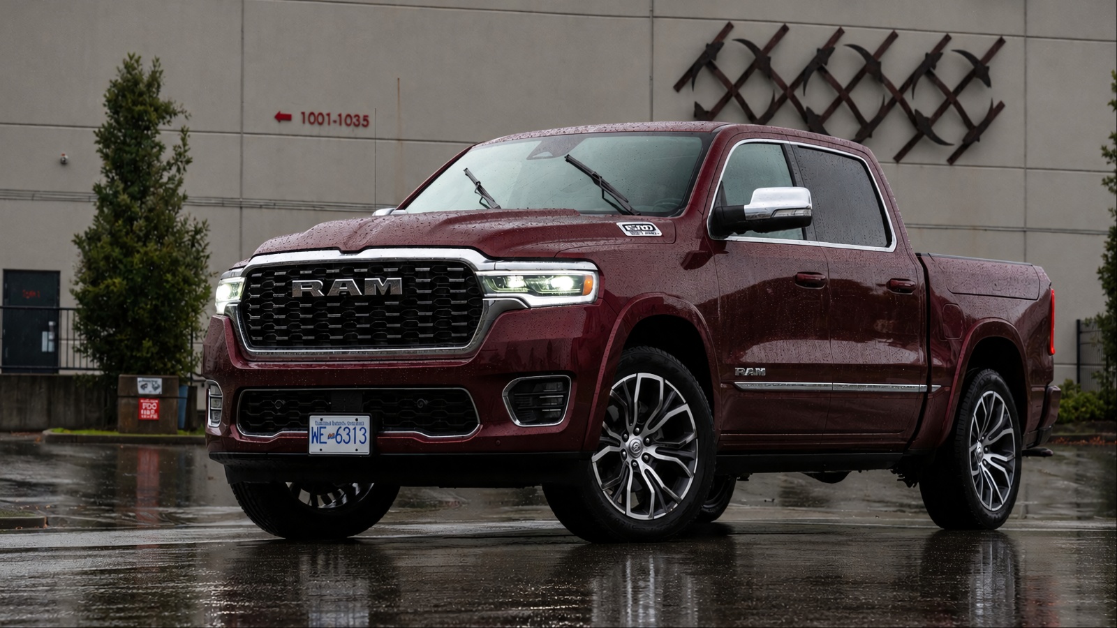 Ram 1500 is standing behind a factory