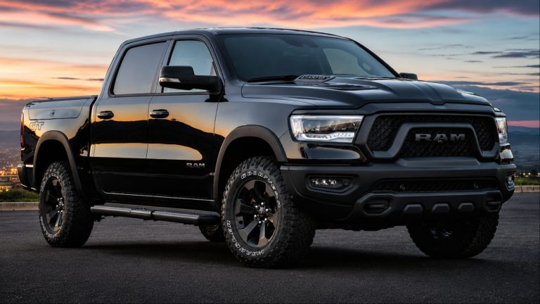 Ram 1500 pickup truck parked against a scenic sunset backdrop