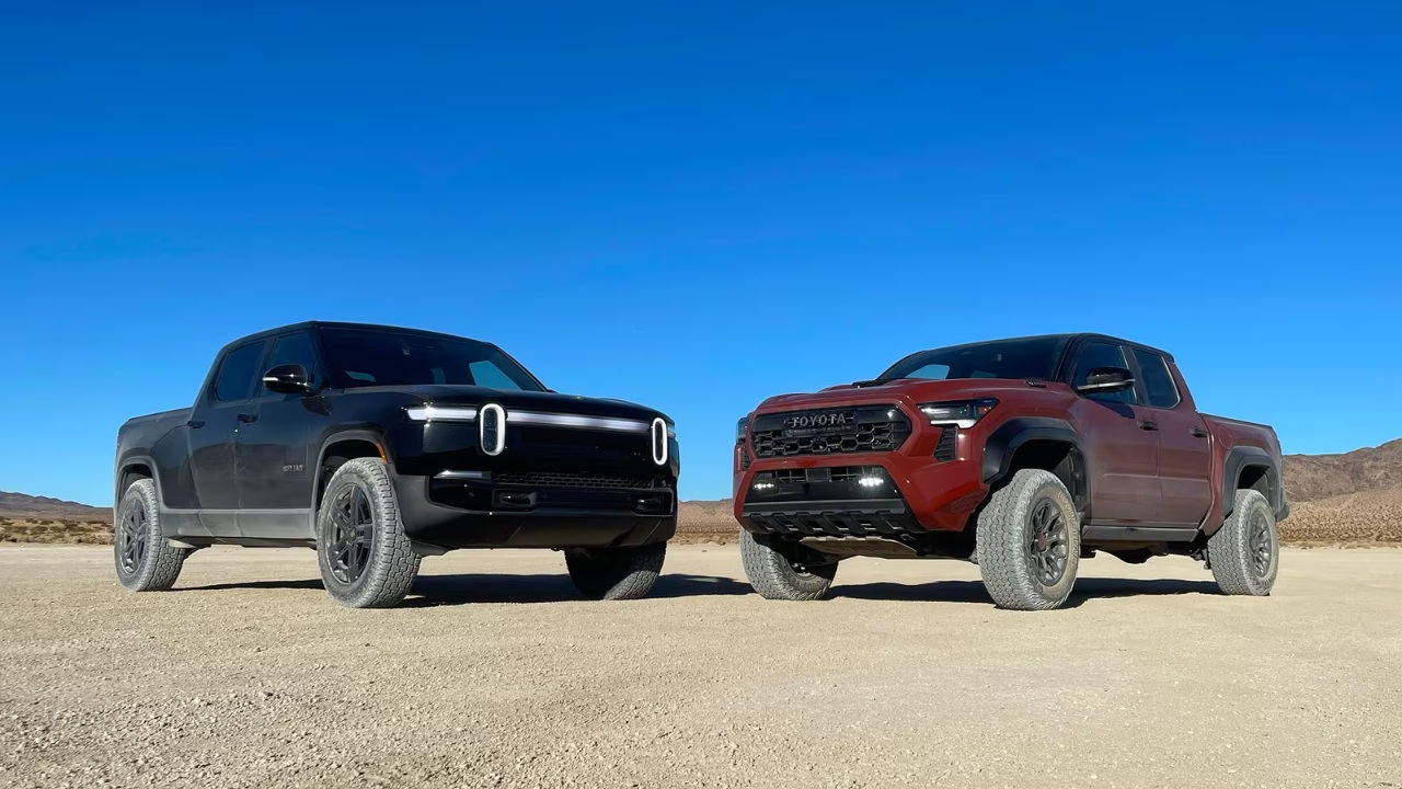 Rivian R1T and Toyota Tacoma pickups parked side by side in a desert setting