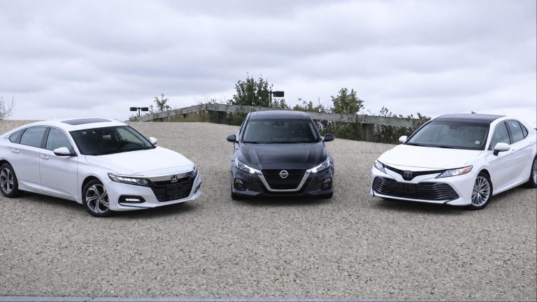 Toyota Camry, Honda Accord, and Nissan Altima lined up for a midsize sedan comparison