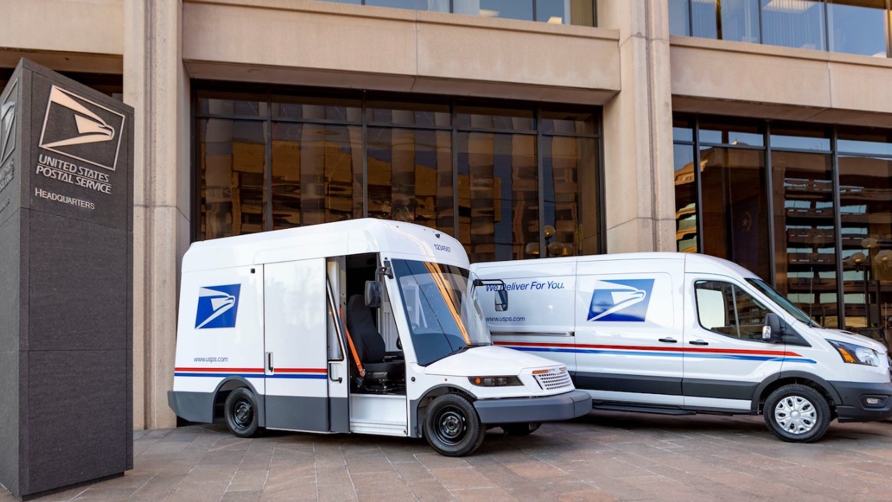 USPS delivery vehicles parked outside the United States Postal Service headquarters