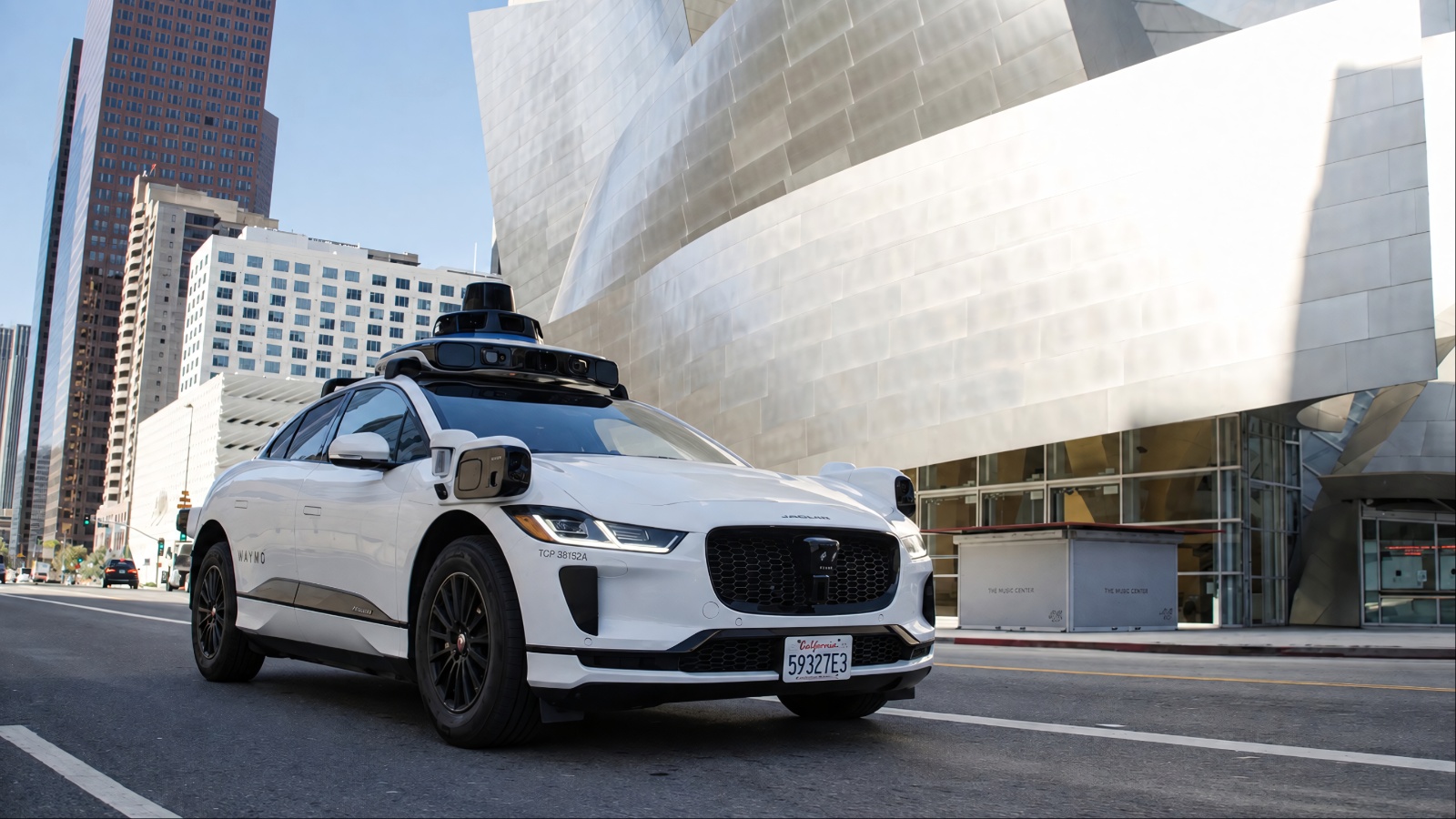 Waymo robotaxi operating on city streets, highlighting autonomous driving technology