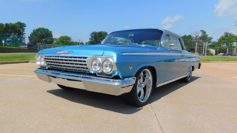 1960s Chevrolet Impala classic car parked outdoors under bright sunshine