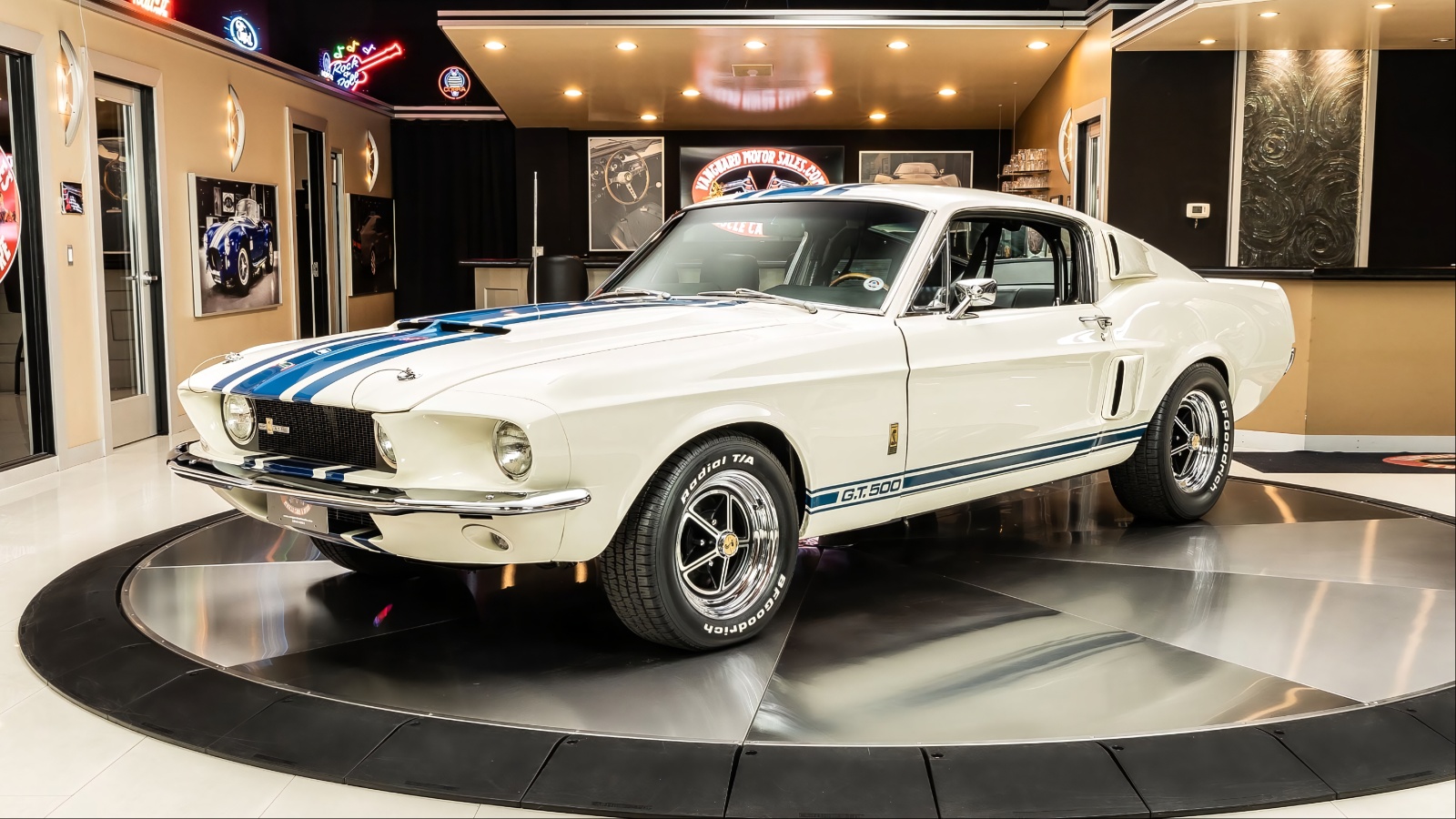 White 1967 Shelby GT500 Super Snake classic car in showroom