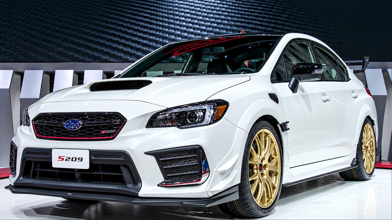 White Subaru WRX STI S209 with gold wheels parked indoors