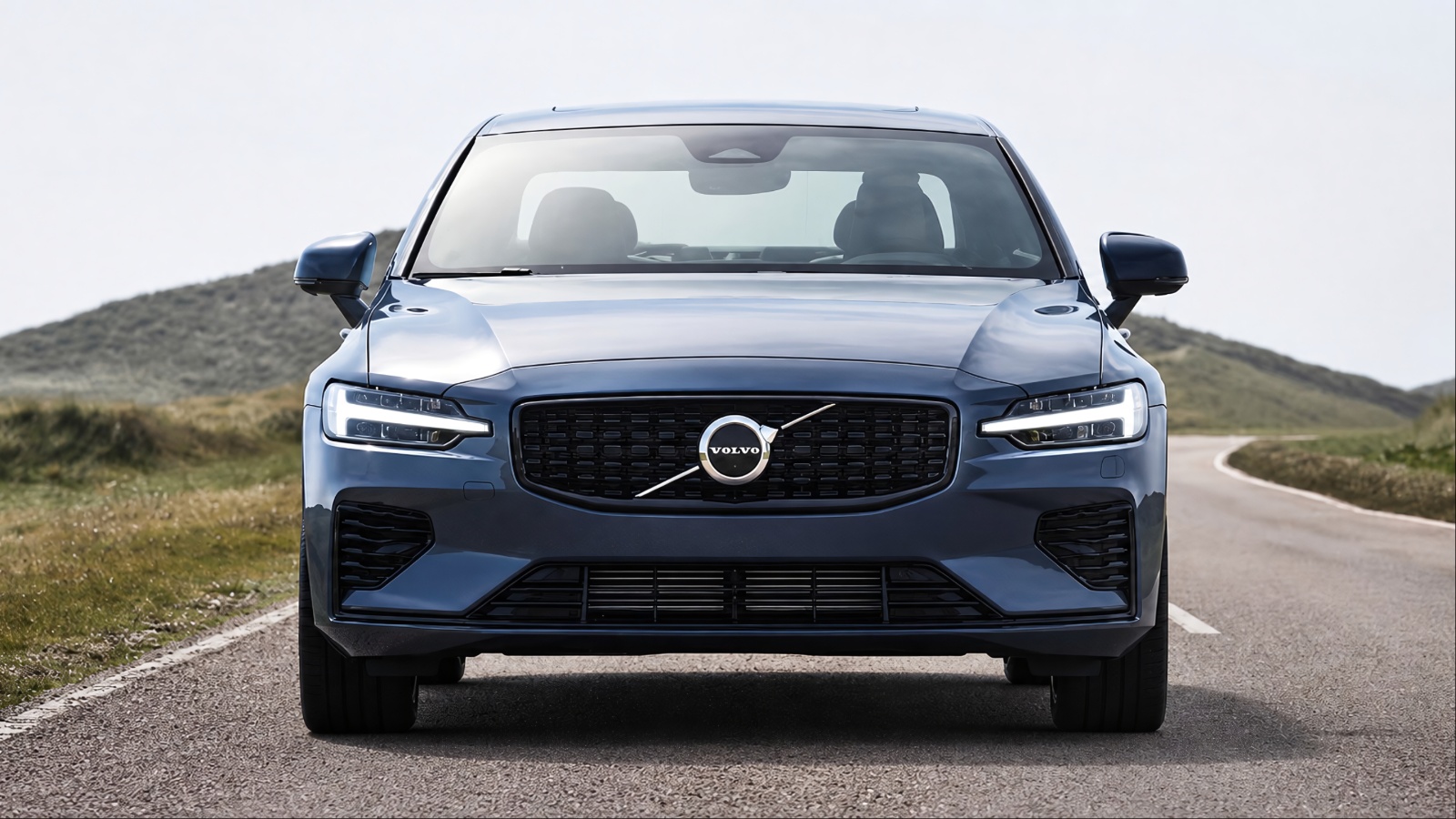 Front view of dark blue 2020 Volvo S60 on road