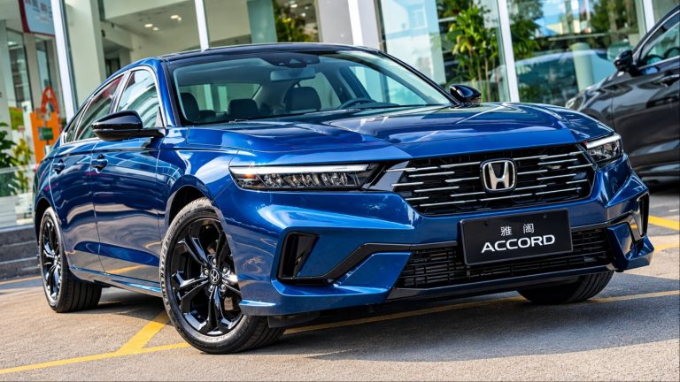 Blue Honda Accord sedan on display in car dealership showroom