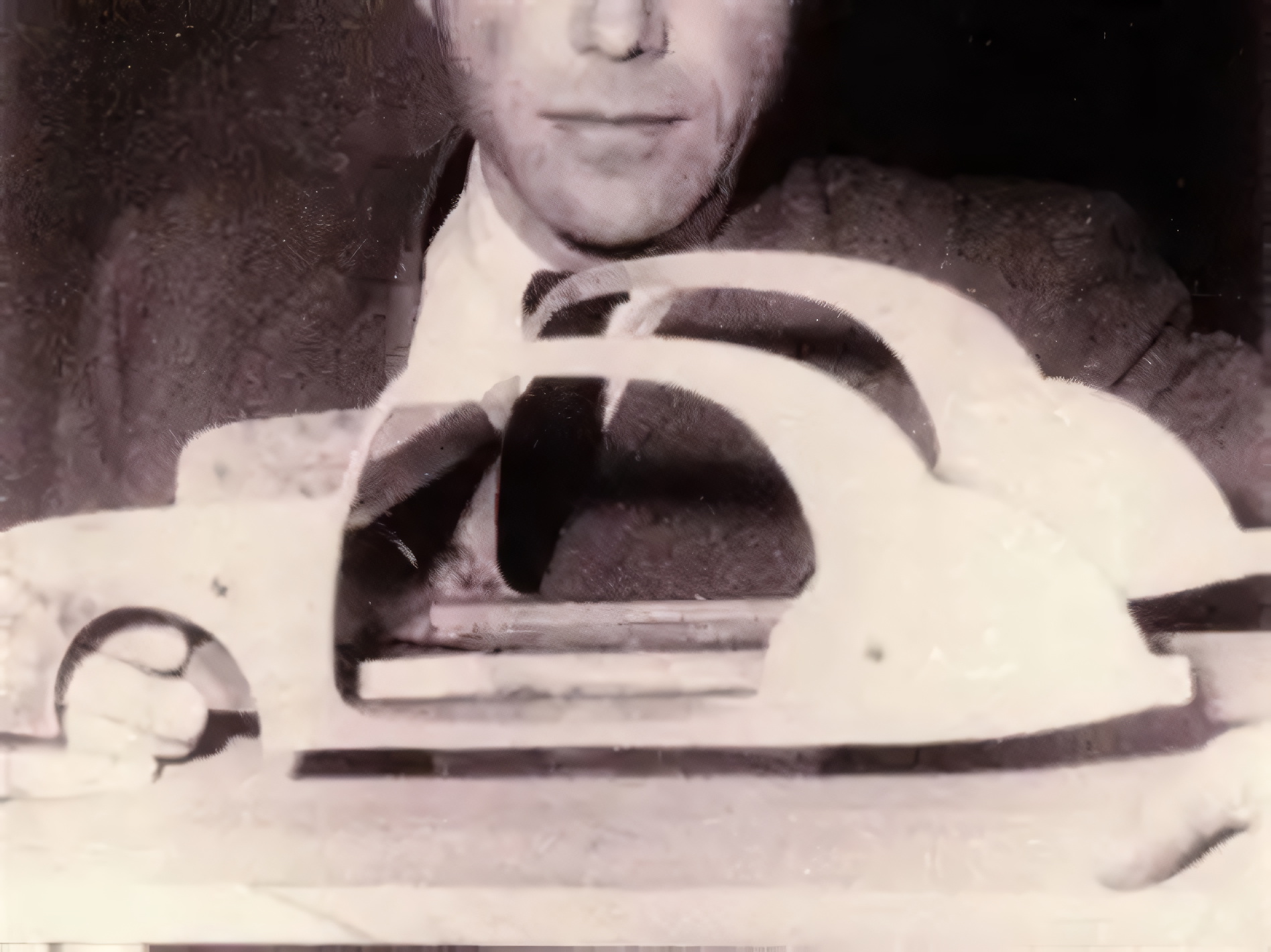 Béla Barényi holding a scale model of a car