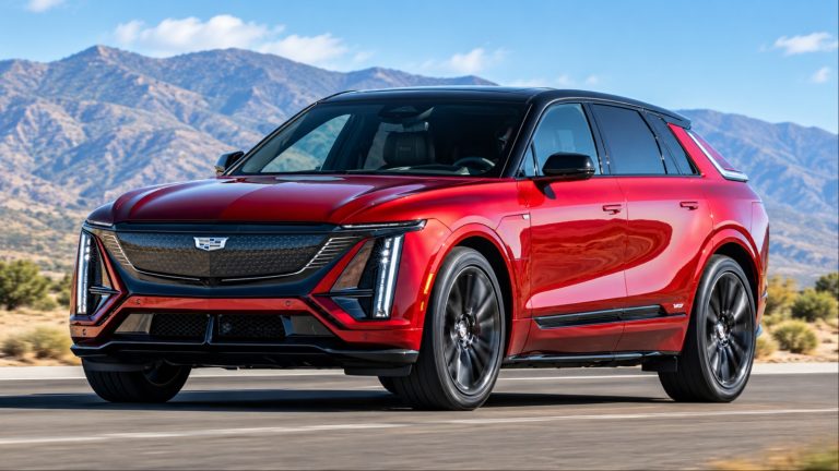 Sleek red Cadillac SUV driving on desert road with mountains