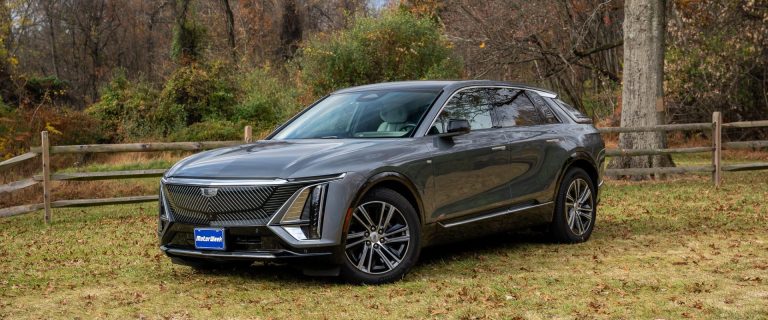 A Cadillac Lyriq is standing on a farmland