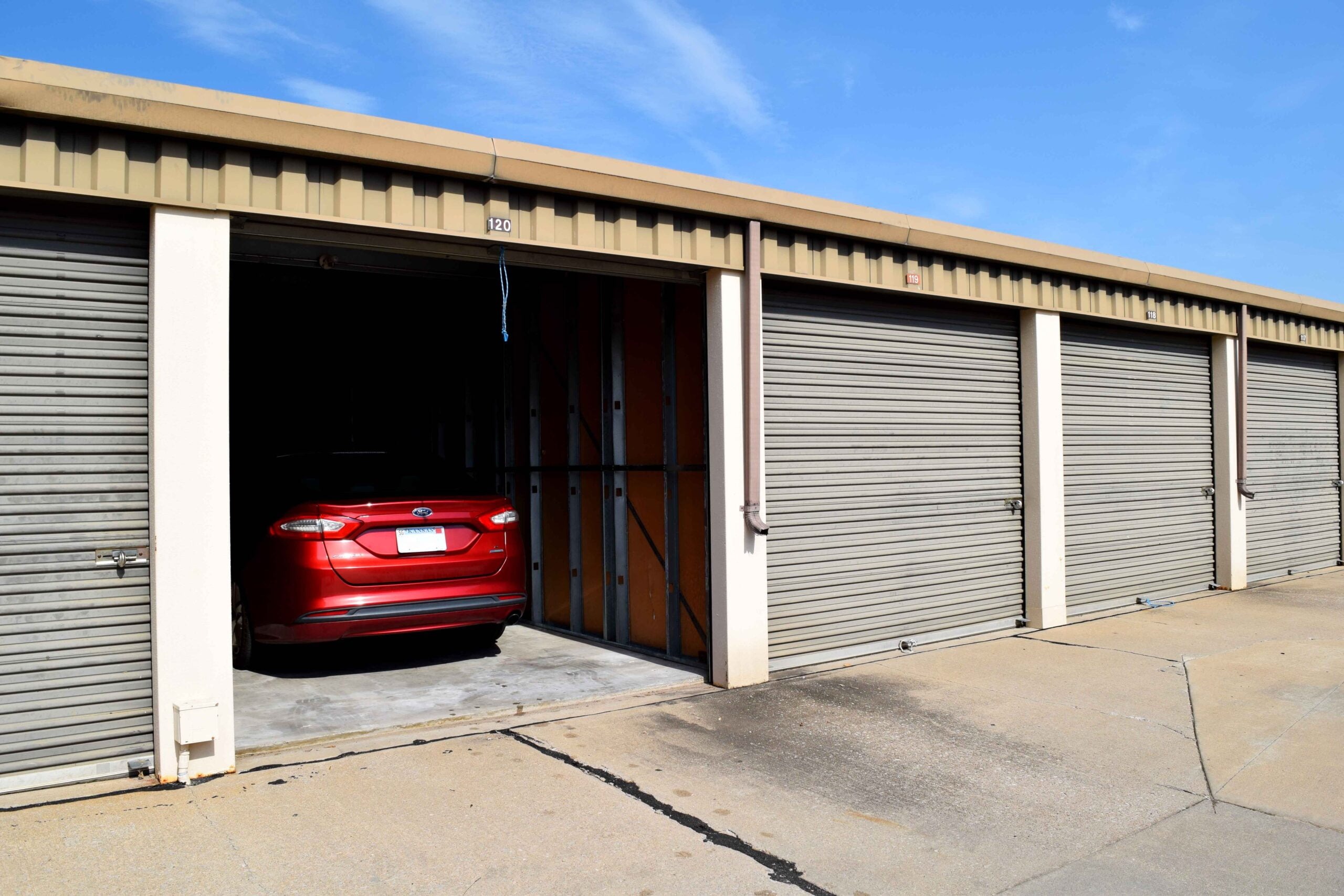Car parked inside a single-unit storage facility