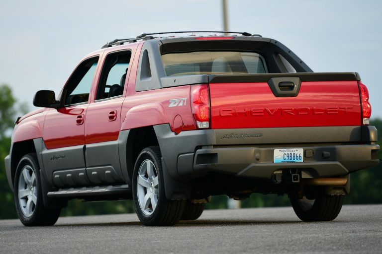 A Chevy Avalanche is standing on a concrete road