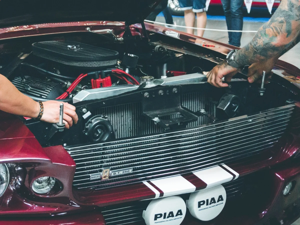 A mechanic is repairing his car's radiator