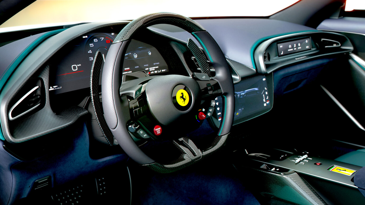 Ferrari interior showcasing the steering wheel, digital gauges, and central touchscreen