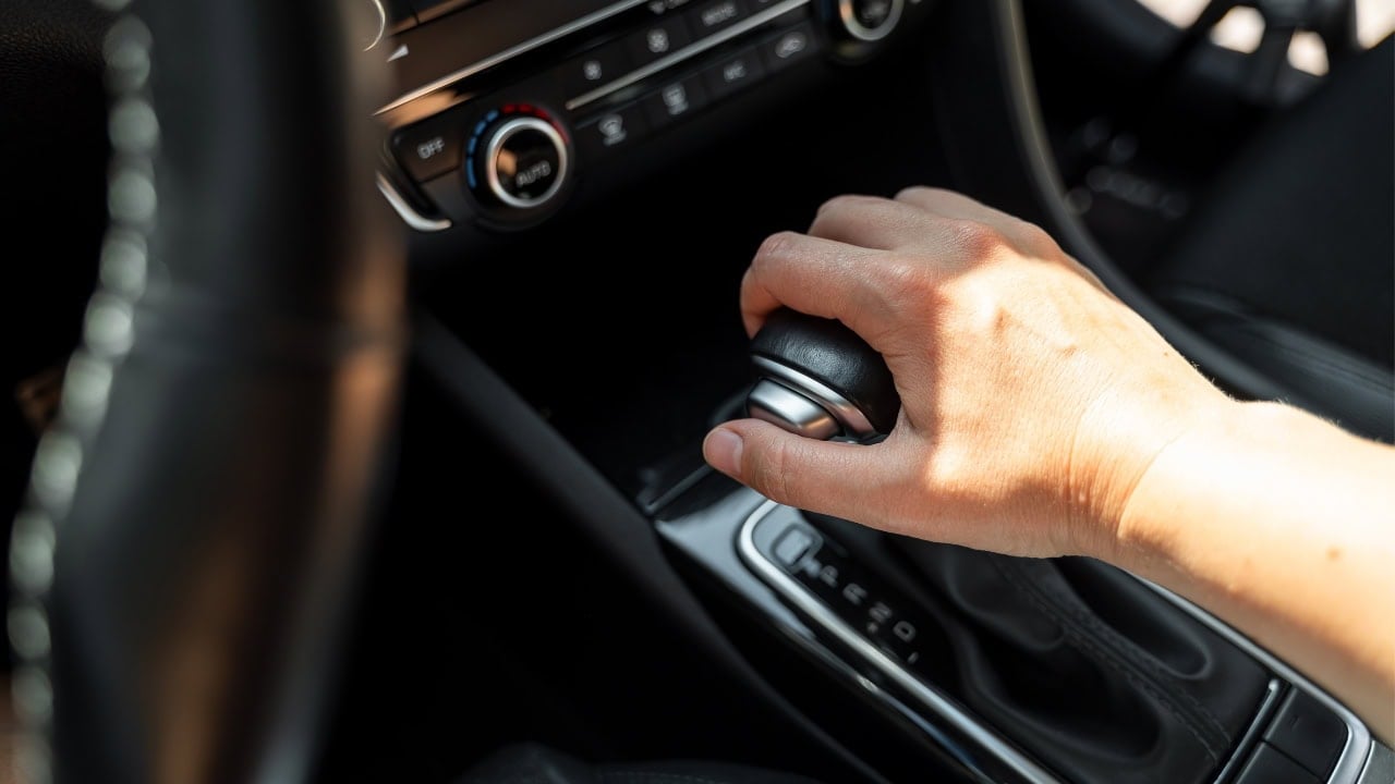 Hand resting on gear shift