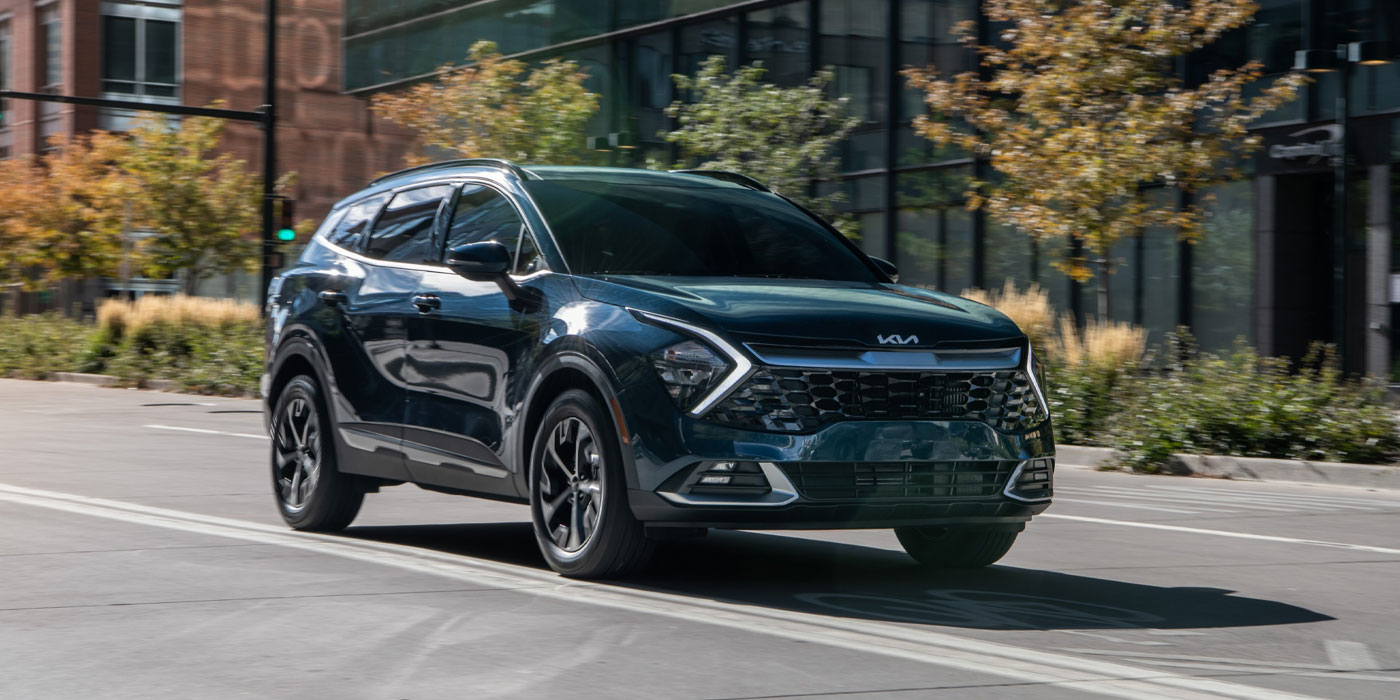 A Kia Sportage sis cruising on a highway