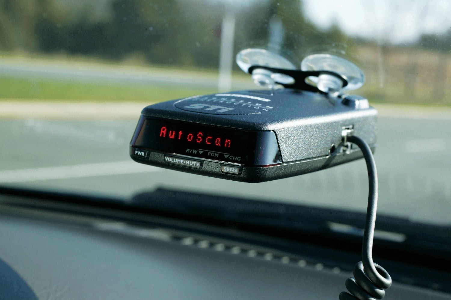 Radar detector mounted on a car dashboard
