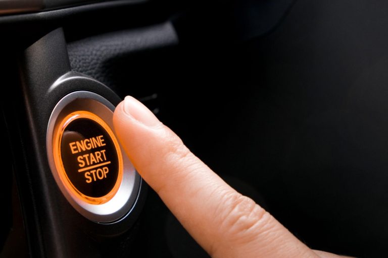 Driver pressing engine start button