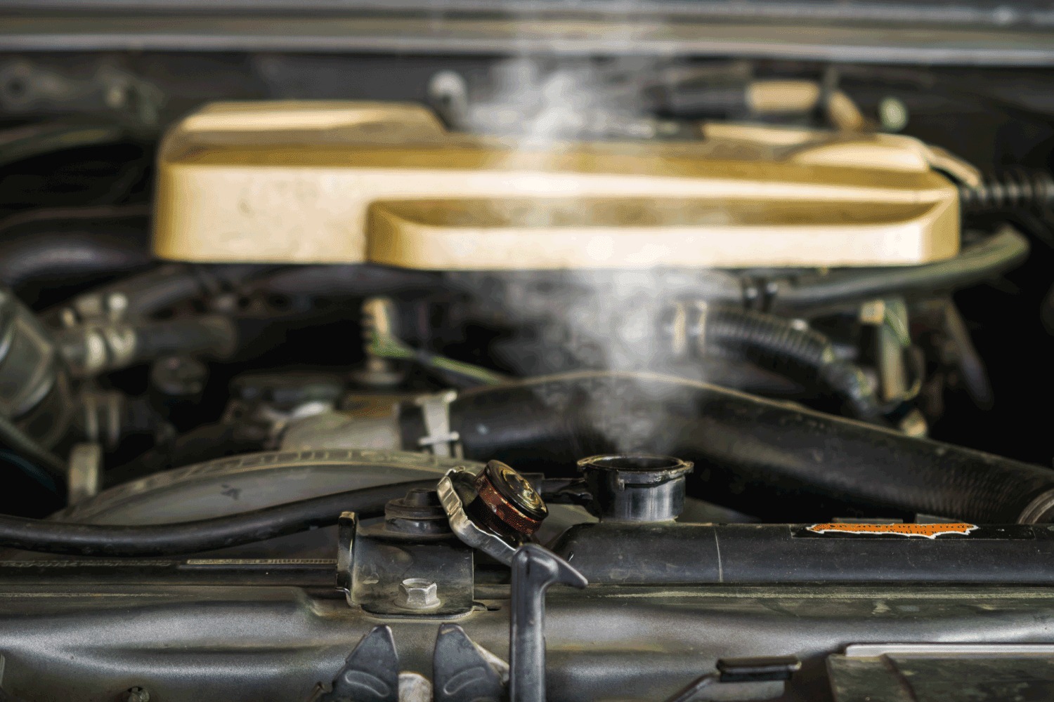 Steam rising from a car's engine bay