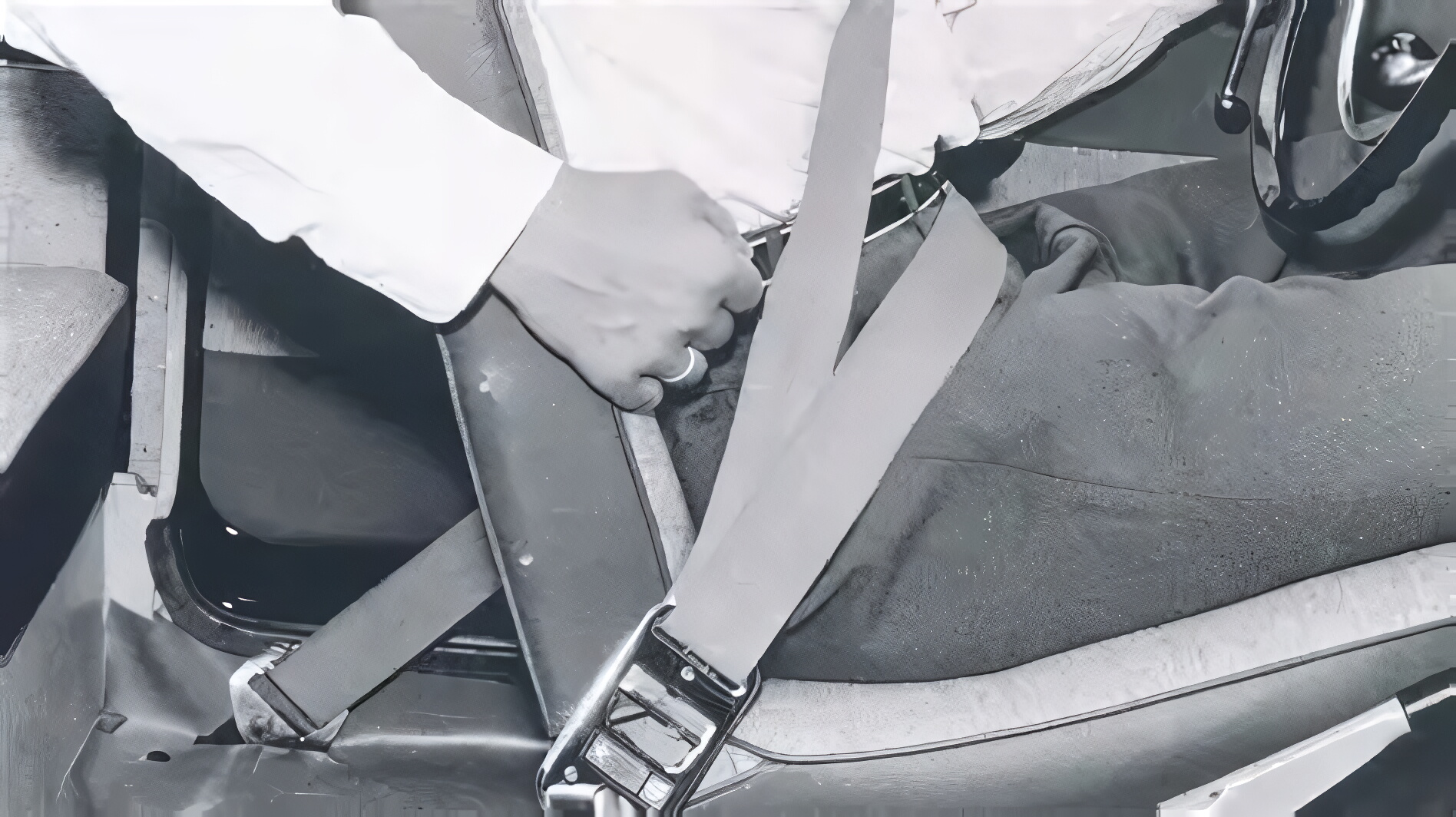 Three-point seat belt inside a vehicle