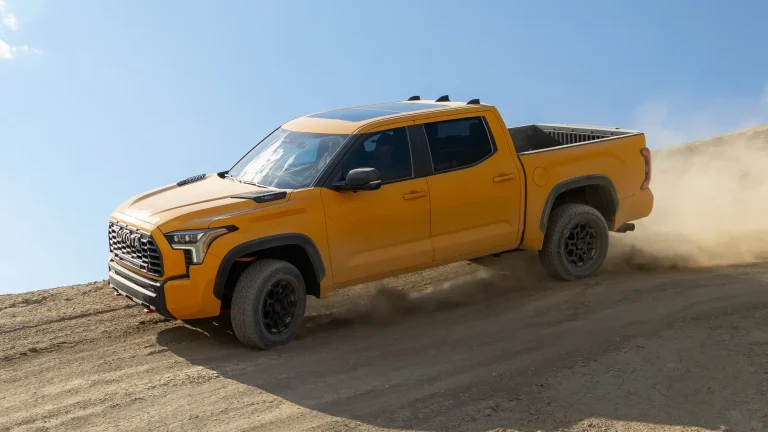 A Toyota Tundra is off roading on a hilly desert