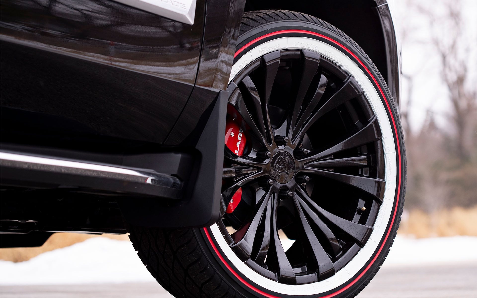 Vogue Tyre Custom Built Radial SCT2 Red Stripe tire mounted on a black SUV wheel