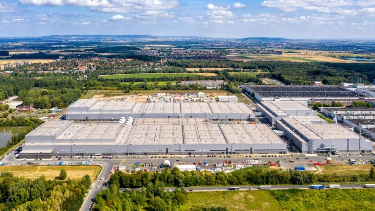Aerial view of Volkswagen’s large industrial facility surrounded by fields, roads, and countryside