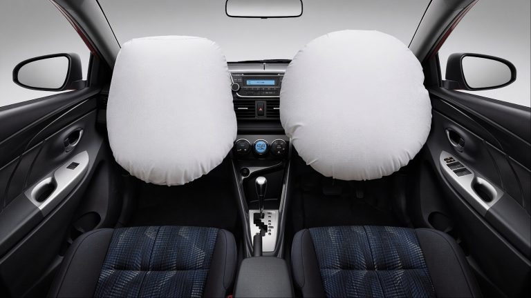 Front view of car with two white airbags fully deployed