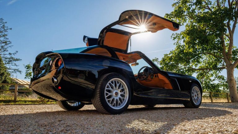 Black Bristol Fighter with raised canopy doors and a striking tan leather interior