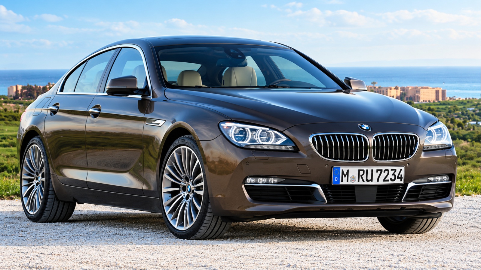 BMW 7 Series sedan parked on a scenic coastal road