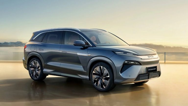 BYD Sealion 8 SUV positioned against a scenic mountain backdrop at sunset