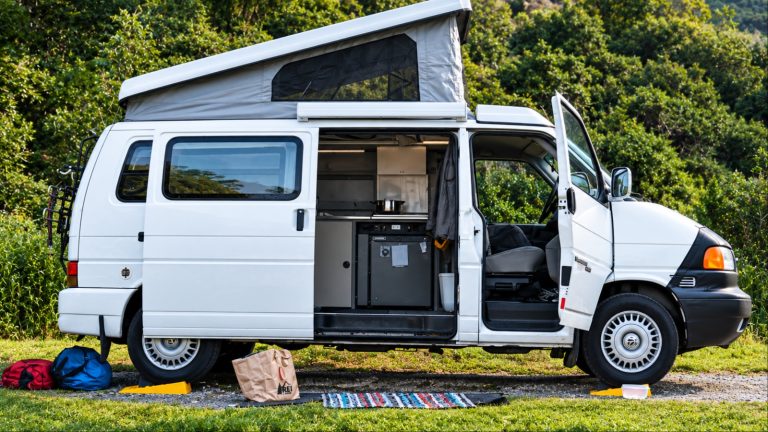 A Camper Van is shown with open stance and extra utilities