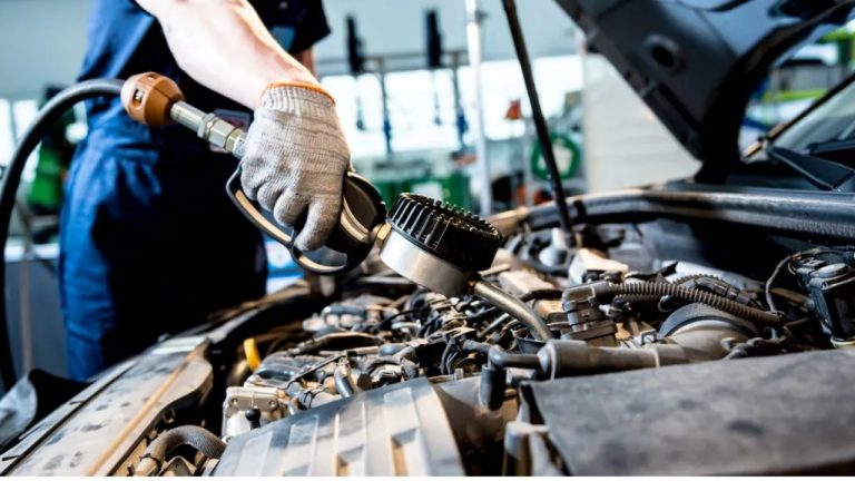 Car engine being professionally serviced at an automotive repair facility