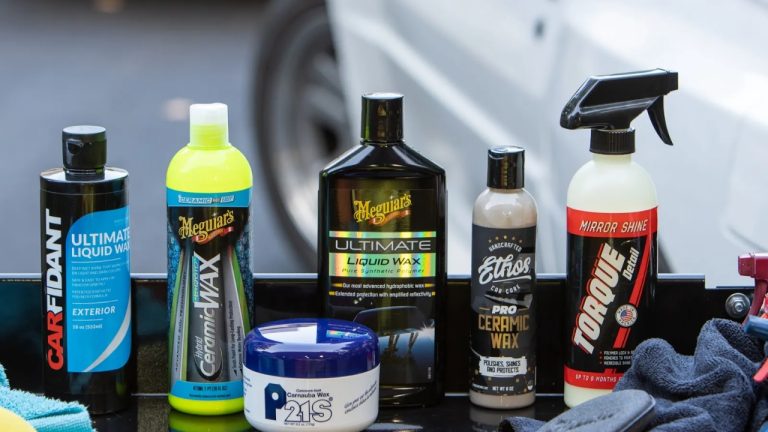 Car wax products arranged for comparing paint protection and shine