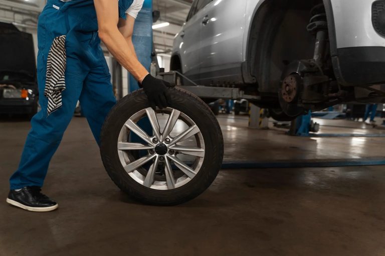 Car tire in a professional auto repair shop