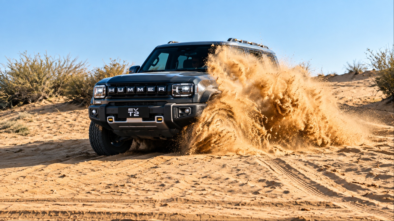 Dark Hummer EV drives through desert sand kicking up dust